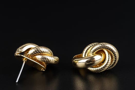 Jewelry earrings and costume jewelry on a black background photo
