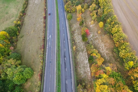 British Motorways, roads and highways passing through countryside, aerial view with drone's camera. photo
