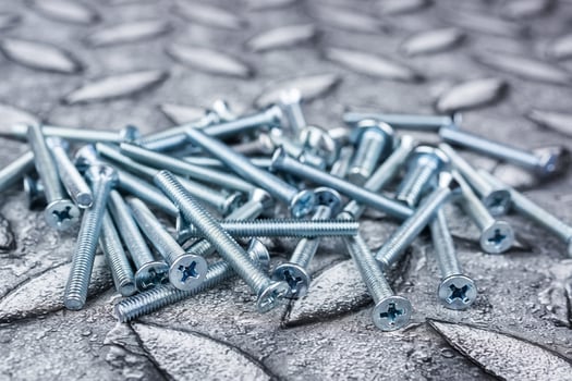 screw on metal background photo