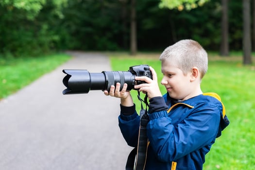 the boy with the camera photo
