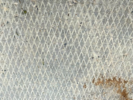 Industrial iron rusty metal surface with rhombuses anti slip background, texture photo