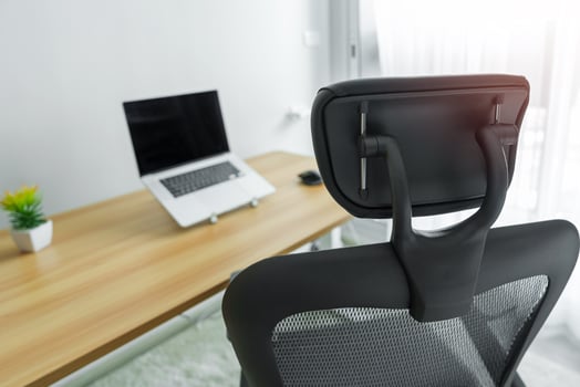 Ergonomic chair and Adjustable table with laptop computer in modern workplace. Good posture to avoid Office syndrome, Back Pain, shoulder ache, fibromyalgia and Neck pain photo