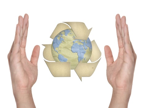 Paper recycling symbol on hand isolated photo