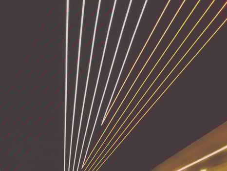bright strips of LEDs on the ceiling. blue and white stripes, illumination. decoration of the ceiling in the subway. bright ribbons in the style of geometry fly to the plane photo