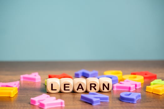 Learn  word cube with English Alphabet background ,English language learning concept. photo