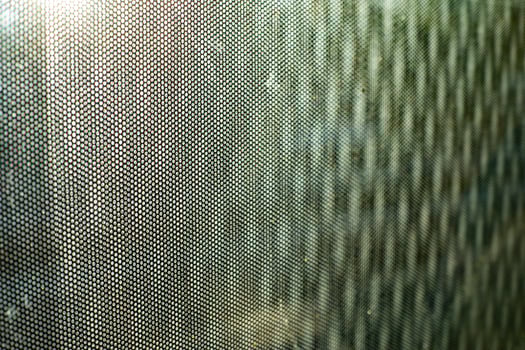 Glass surface in film. Texture of film on window. Blurry background of small waves. photo