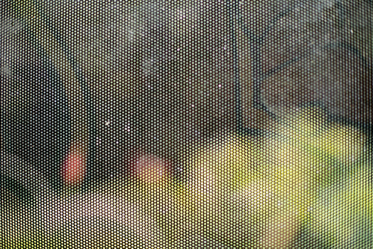 Film on glass of mesh texture. Advertising film from inside interior of bus. photo
