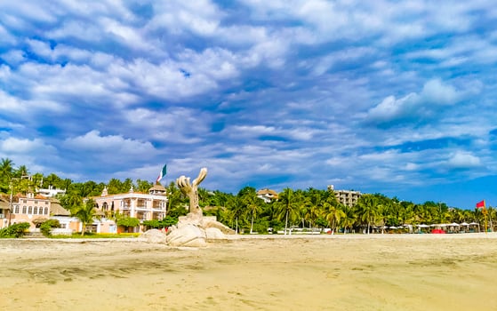 Palms parasols sun loungers beach resort Zicatela Puerto Escondido Mexico. photo