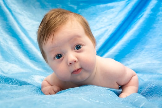 baby on a red cloth photo