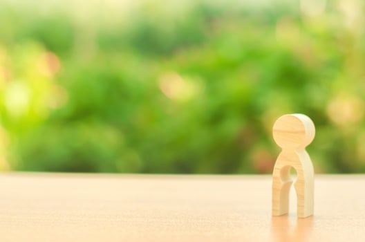 Figurine of a woman with emptiness inside in the form of a child. concept of loss of child, abortion of pregnancy, miscarriage. Female infertility and medical treatment. Demography and family planning photo