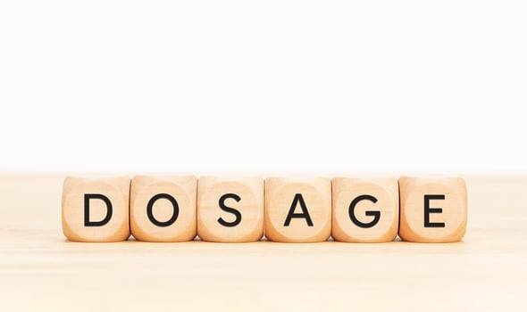 Dosage word on wooden blocks. Copy space photo