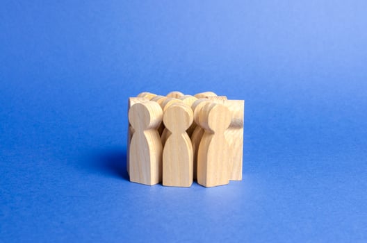 A crowd of wooden figures of people. Social survey and public opinion, electorate. Population and citizens. Society, social group. management of people. investing in human resources. Faceless crowd photo