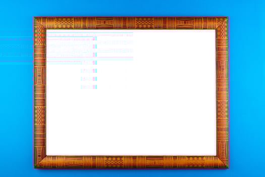 Wooden frame blue background photo