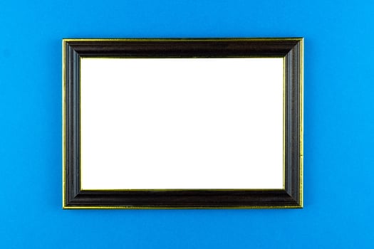 Wooden frame blue background photo