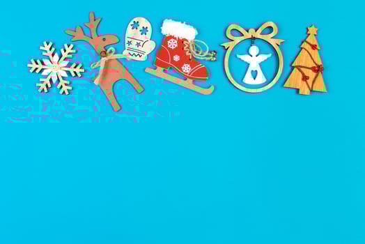 Top view of holiday ornament made of Christmas decorations on colorful background. New Year time concept with copy space photo