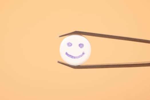 smile tablet lsd trip, happy psychedelic pill drug closeup photo