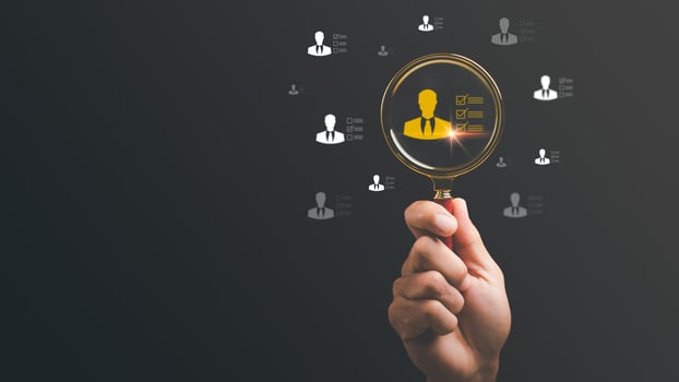 businessman holding a magnifying glass, human resource recruiting concept, job titles and individual competence, Leadership and Excellence, Effective personnel management in the organization photo