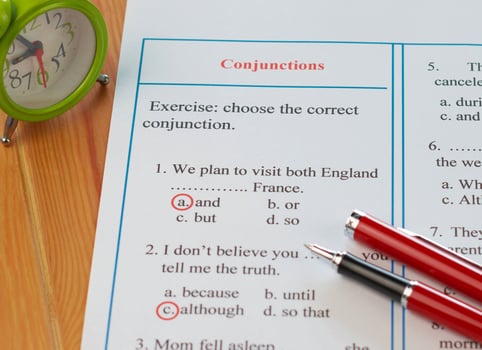 English grammar sheet on wooden table photo