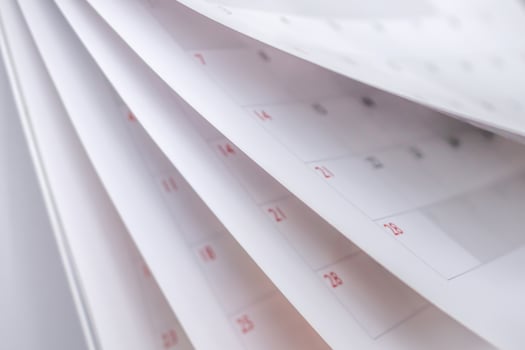 Calendar page flipping sheet close up blur background business schedule planning appointment meeting concept photo