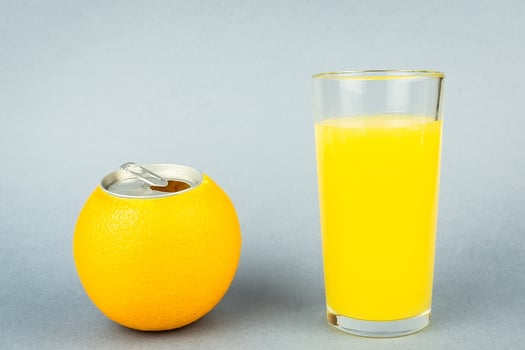 Orange juice on grey background photo