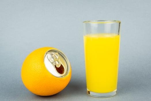 Orange juice on grey background photo