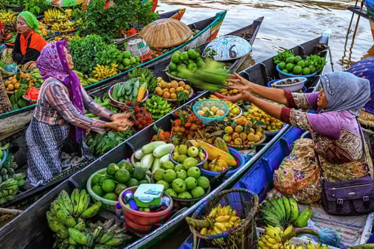 Banjarmasin, Indonesia - March 22, 2014, Ways and styles of transactions on a floating market. photo