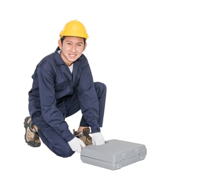 Young handyman sitting with his tool box photo