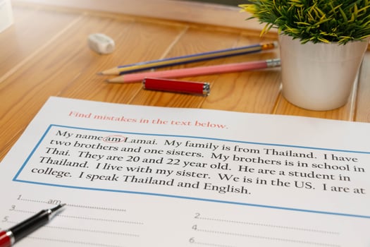 English exercise to find mistake grammar on wooden table photo