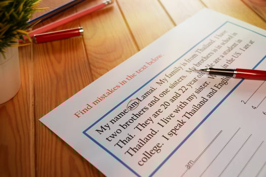 English exercise to find mistake grammar on wooden table photo