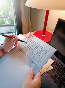 paperwork for proofreading on wooden table photo