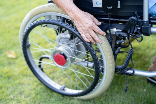 Asian senior or elderly old lady woman patient on electric wheelchair with remote control at nursing hospital ward, healthy strong medical concept photo