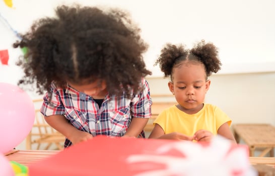 Two little girls Playing with plasticine photo