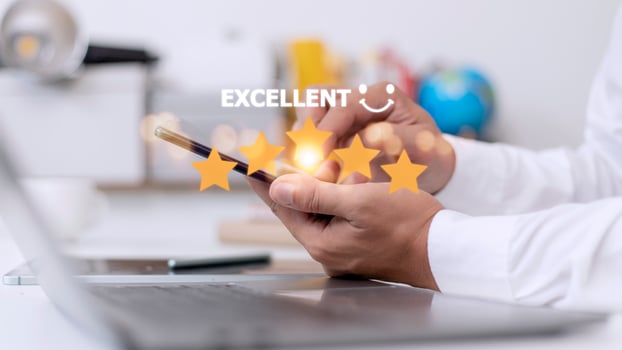 customer hand  with gold five star rating feedback icon and press level excellent rank for giving best score point to review the service, business concept photo