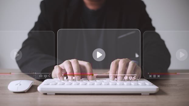 man using mouse and keyboard for streaming online, watching video on internet, live concert, show or tutorial photo