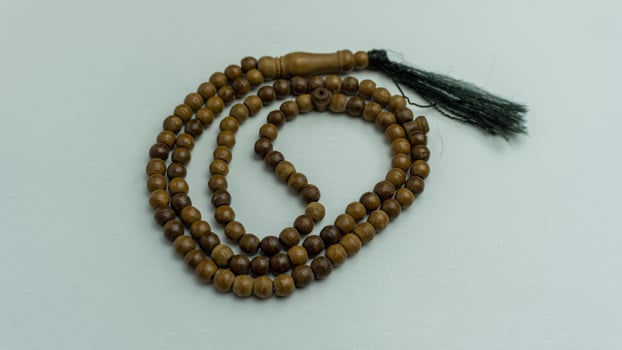 wooden tasbih beads isolated. islamic prayer beads photo