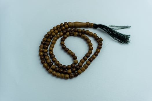 wooden tasbih beads isolated. islamic prayer beads photo