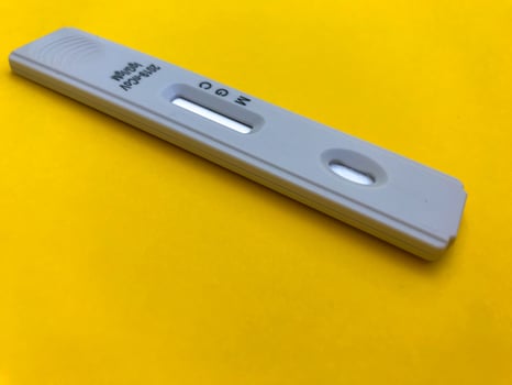 Express COVID-19 test for detection of specific antibodies IgM and IgG to novel coronavirus SARS-CoV-2 that cause Covid-19. Medic or doctor applies blood photo