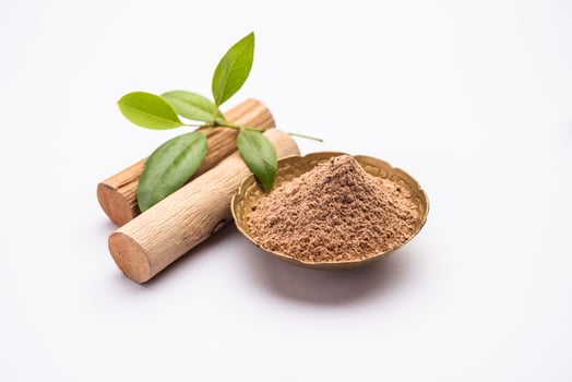 Chandan or sandalwood powder with sticks, perfume or oil which retain their fragrance for decades photo