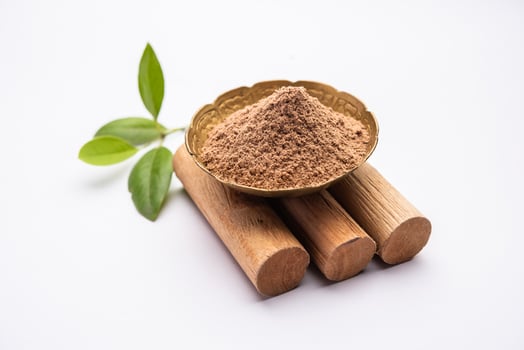 Chandan or sandalwood powder with sticks, perfume or oil which retain their fragrance for decades photo