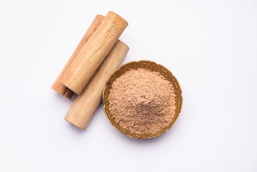 Chandan or sandalwood powder with sticks, perfume or oil which retain their fragrance for decades photo
