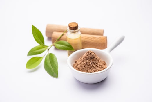 Chandan or sandalwood powder with sticks, perfume or oil which retain their fragrance for decades photo