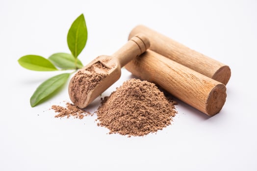 Chandan or sandalwood powder with sticks, perfume or oil which retain their fragrance for decades photo