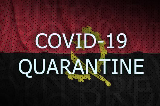 Angola flag and Covid-19 quarantine inscription. Coronavirus or 2019-nCov virus photo