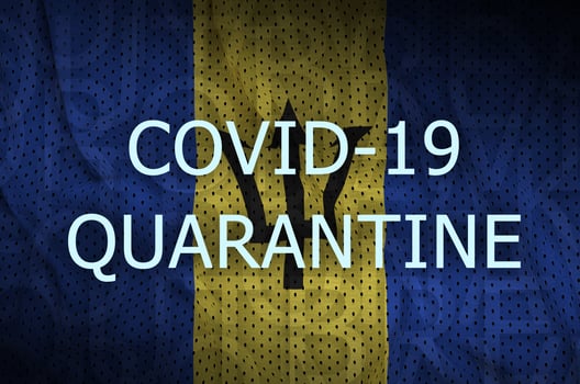 Barbados flag and Covid-19 quarantine inscription. Coronavirus or 2019-nCov virus photo