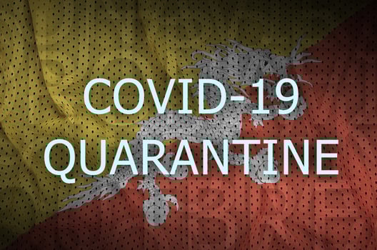 Bhutan flag and Covid-19 quarantine inscription. Coronavirus or 2019-nCov virus photo