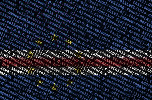 Cabo verde flag is depicted on the screen with the program code. The concept of modern technology and site development photo