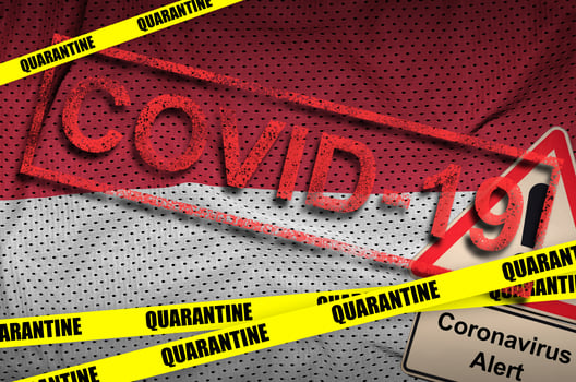 Monaco flag and Covid-19 quarantine yellow tape with red stamp. Coronavirus or 2019-nCov virus photo