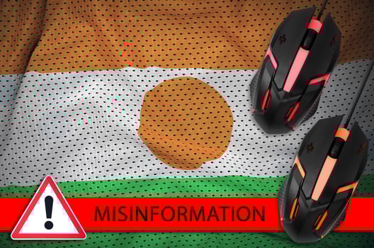 Niger flag and two computer mouses. Misinformation during Coronavirus or 2019-nCov virus concept photo