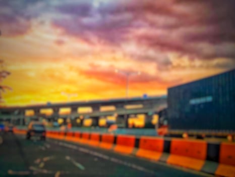 Defocused blurred abstract background of traffic jam at night in east Jakarta. The rear view, the red and yellow lights or the brake lights of the cars are on. photo