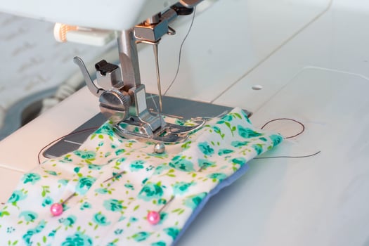 Sew the fabric mask with the sewing machine to prevent the Novel Coronavirus 2019 or Covid-19. Due to the scarce hygienic mask. photo
